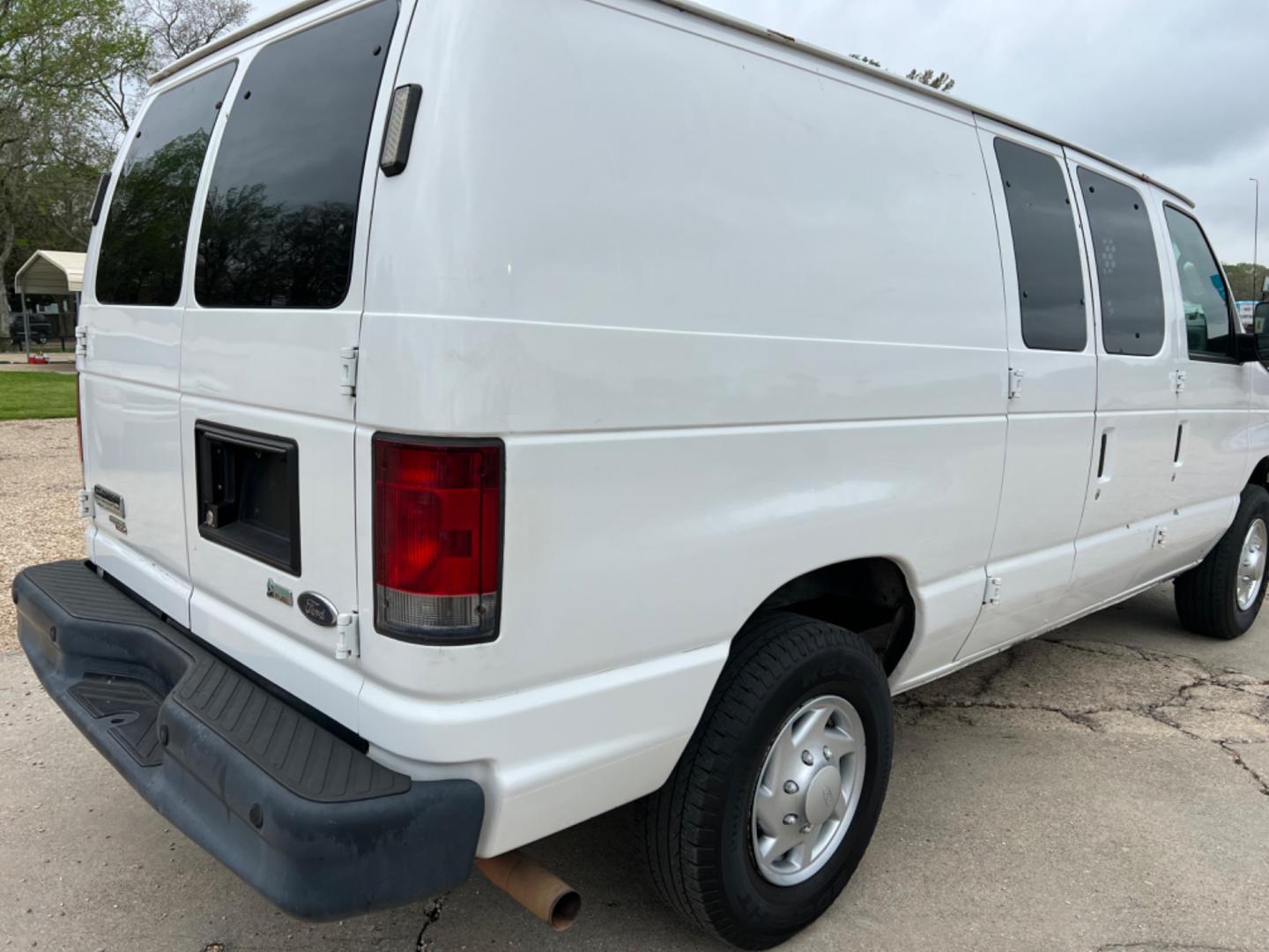 2012 White /Gray Ford E-Series Van (1FTNE2EL7CD) with an 5.4 V8 engine, Automatic transmission, located at 4520 Airline Hwy, Baton Rouge, LA, 70805, (225) 357-1497, 30.509325, -91.145432 - 2012 Ford E-250 Cargo Van 5.4 V8 Gas, 156K Miles, Power Windows & Locks, Shelves For Tools Or Parts. NO IN HOUSE FINANCING. FOR INFO PLEASE CONTACT JEFF AT 225 357-1497 CHECK OUT OUR A+ RATING WITH THE BETTER BUSINESS BUREAU WE HAVE BEEN A FAMILY OWNED AND OPERATED BUSINESS AT THE SAME LOCATION FOR - Photo#5